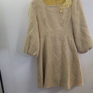 Elegant Beige Dress with Floral Detail